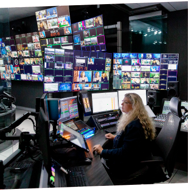 An employee monitors several screens to ensure that the images captured by our field teams are fed into our editing rooms for recording and/or live broadcast.